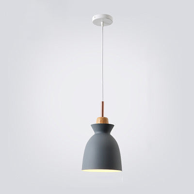 Wood bell dome pendant over a breakfast nook table