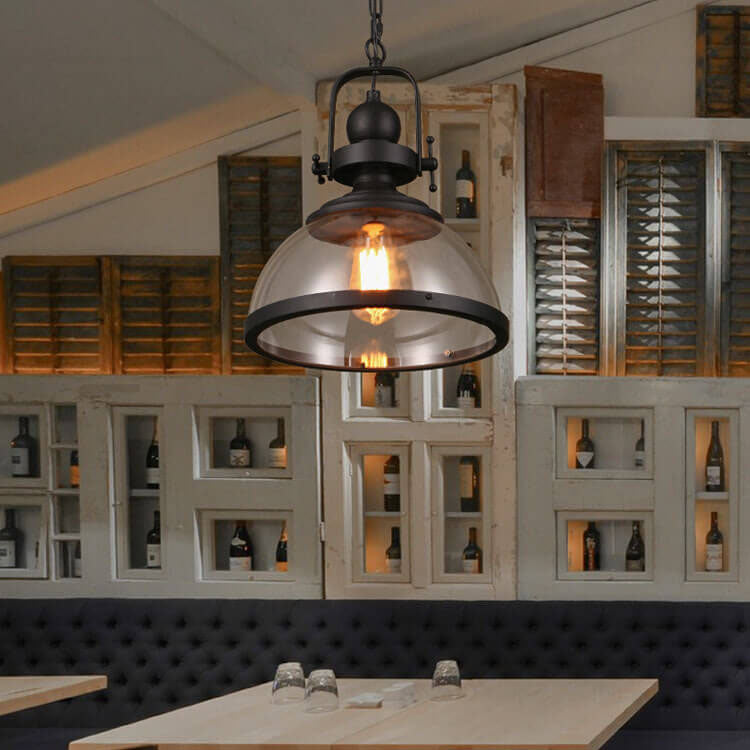 Schoolhouse-style glass dome pendant light with a black metal frame
